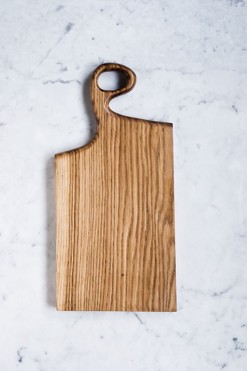 Oak cutting board on a marble surface